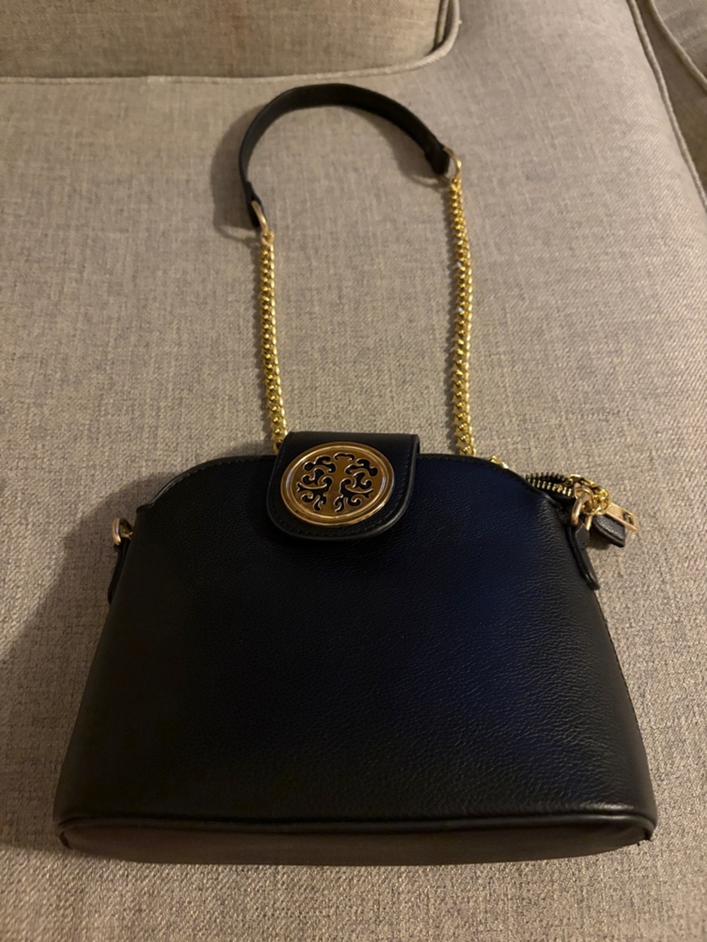 Black Leather Crossbody Bag with Gold-Tone Chain and Medallion